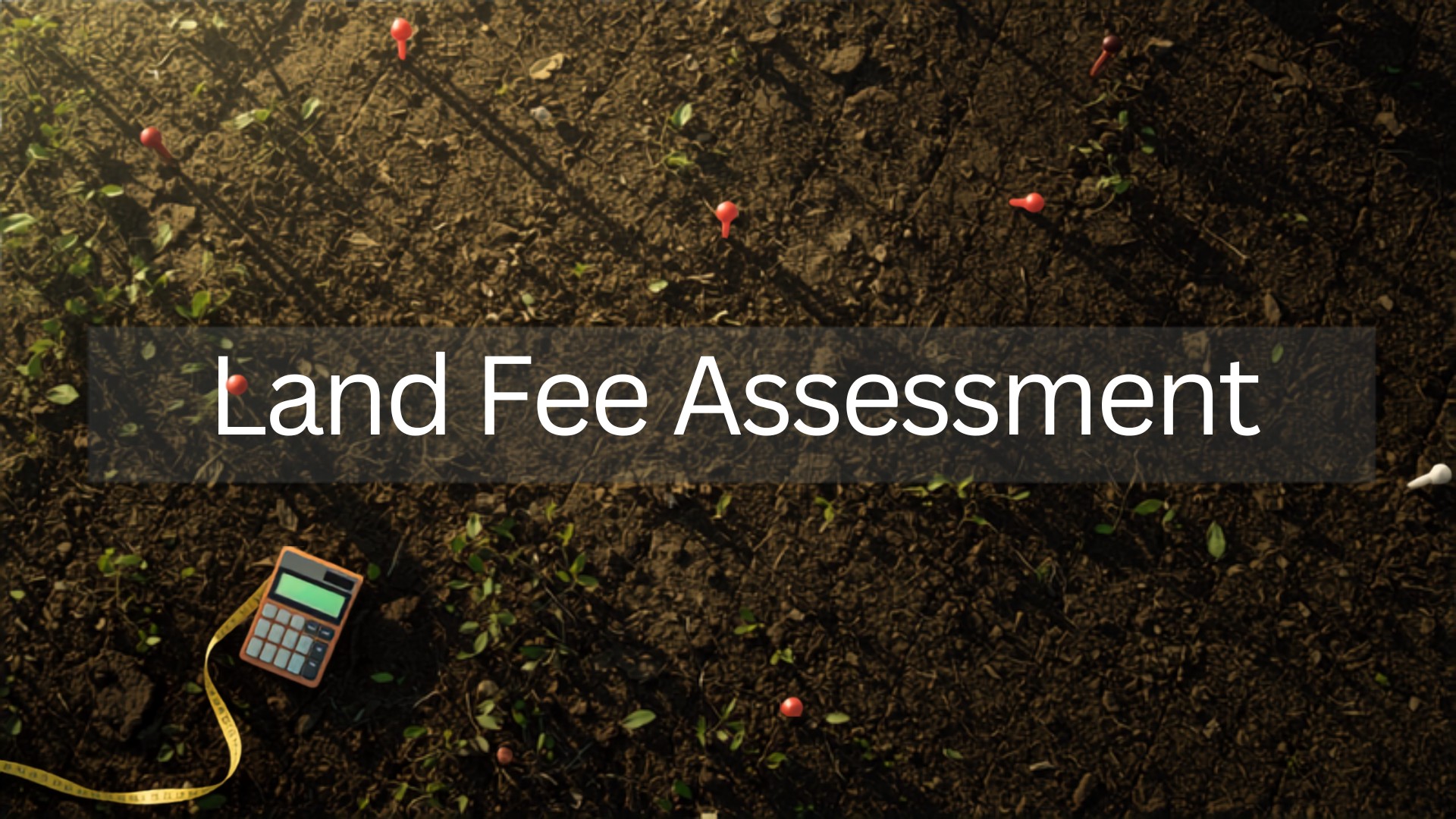 Farmland with survey markers and measurement equipment